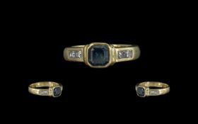 Ladies 18ct Gold Contemporary Design Sapphire & Diamond Set Ring, the central stepped blue