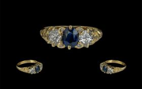 Antique Period Attractive Three Stone Diamond and Sapphire Set Ring with ornate gallery setting;