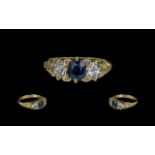 Antique Period Attractive Three Stone Diamond and Sapphire Set Ring with ornate gallery setting;