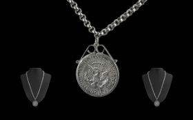 1964 Half Dollar set in pendant with silver mount, set on a 22" belcher chain.