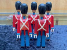 Five Wooden Soldiers, hand painted, 9" tall. Inside of each leg is the maker's name Kay Bojesen.