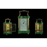 An English Henley Carriage Clock, with a Malacite trim and brass case.