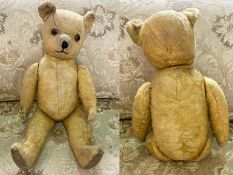 Vintage Teddy Bear, moveable limbs, glass eyes, measures approx 22" in height.