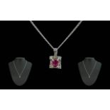 Ladies - 18ct White Gold Diamond and Ruby Set Pendant with Attached 18ct White Gold Chain.