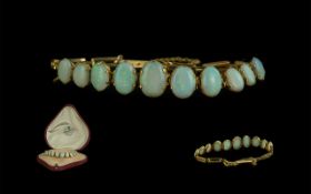 Antique Period 9ct Gold Opal Set Bracelet - The Opals In Graduated Form and Excellent Colour.