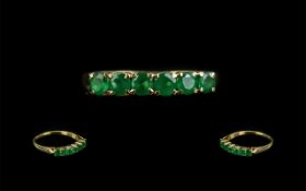 Ladies 18ct Gold Attractive Six Stone Emerald Set Ring, marked to shank; the well matched,