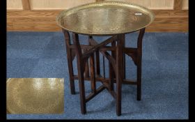 Middle Eastern Brass Topped Folding Table, brass engraved top on folding wooden legs.