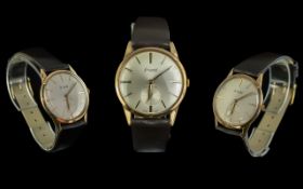 9ct Gold Gent's Accurist Wrist Watch, 21 jewel manual wind, silvered dial with baton numerals.