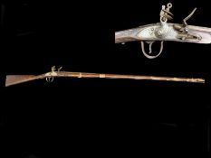 An Indian Made Flintlock Rifle, white metal mounts,