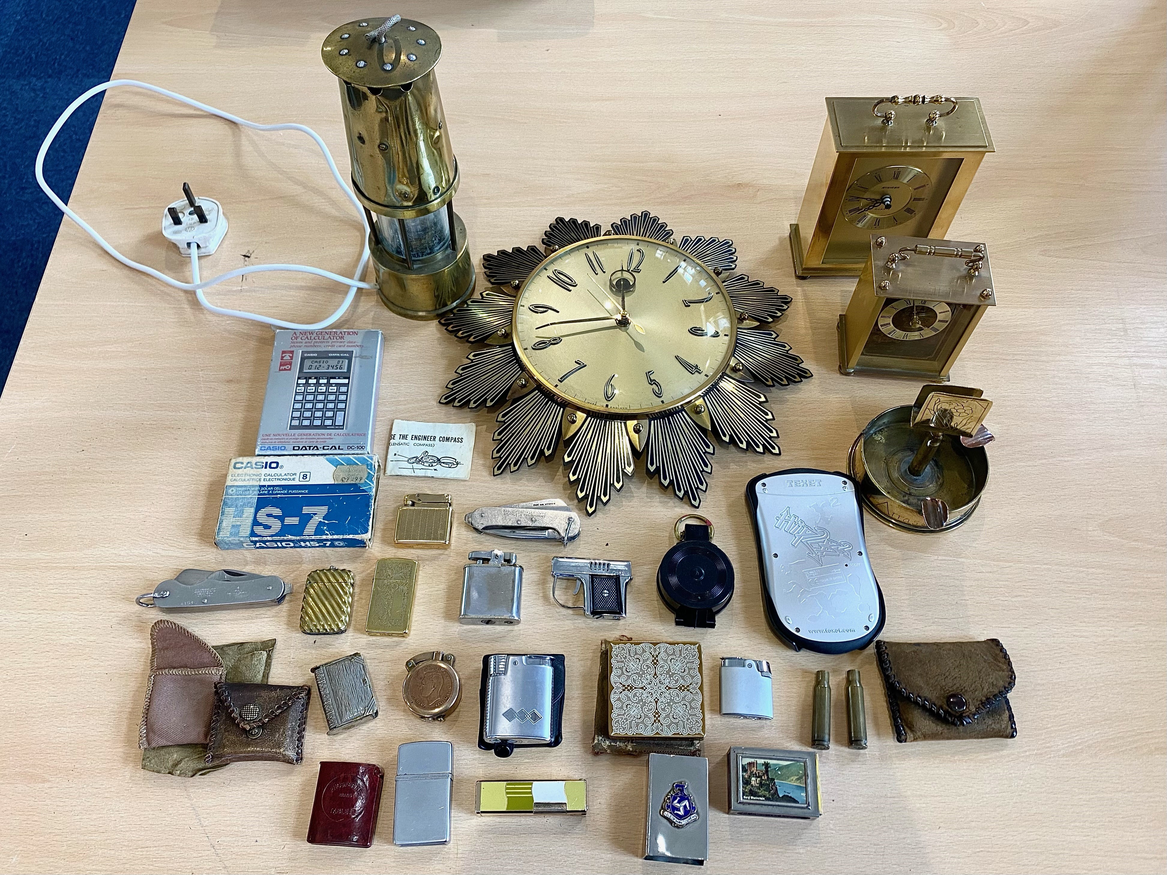 Box of Collectibles, including brass miner's lamp, sunburst wall clock, carriage clocks,