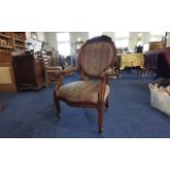 Queen Anne Style Chair, carved wood decoration, two arms, raised on castors,