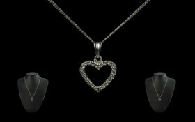 Pandora Necklace, silver heart shaped pendant set with crystals, suspended on a silver chain.