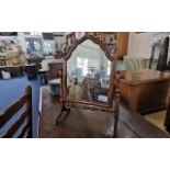 Georgian Freestanding Mirror, walnut, shaped form, domed top, bobbin supports. Measures 15.