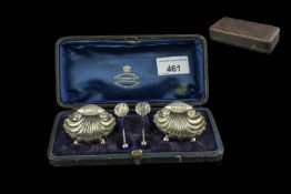 Boxed Set of Two Silver Salt Pots, shell shaped, raised on four ball feet,