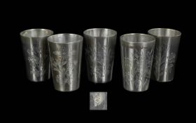 A Set of Five Russian Silver Engraved Vodka Tots, hallmarked 875, measure 2.5" high. Weight 193.