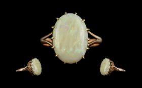 Ladies 9ct Gold Attractive Single Stone Opal Set Ring. The Large Oval Shaped Opal of Good Colours.