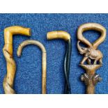 Collection of Wooden Walking Sticks, comprising a slim black twisted wooden stick,