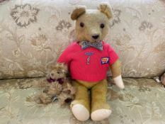 Vintage Busy Bear Teddy, moveable limbs, wearing a red sweater and bow tie. Measures 20" high.