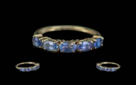 9ct Gold Tanzanite Dress Ring, eternity style set with five oval Tanzanites, ring size N.