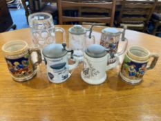 Collection of Tankards, including two pewter lidded German tankards, two pottery Tankards, a glass