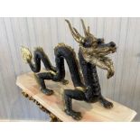 A Large Chinese Style Four Claw Bronze Dragon, brown textured body with gilt highlights. Height 60.