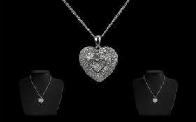 14ct White Gold Attractive Diamond Set Heart Shaped Pendant with Attached 9ct Gold Marked Chain.