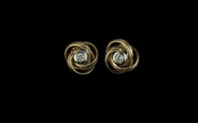 Pair of 9ct Gold Diamond Set Knot Earrings, centre of knot set with round cut diamond. Weight 2.