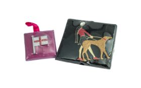 Two Butler & Wilson Brooches, comprising an England flag, and a lady and dog.