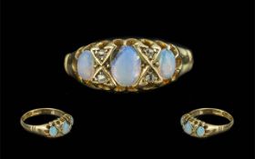 Edwardian Period 1902 - 1910 Attractive 18ct Gold 3 Stone Opal Set Ring with Diamond Spacers.