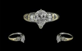 Ladies 18ct White Gold Diamond Set Ring Set with a Single Pear Shaped Diamond at the Centre of