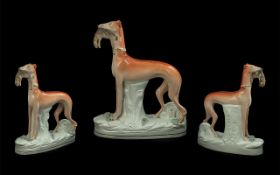 A Large Victorian Greyhound Flatback Staffordshire Figure with a rabbit in mouth. Measures 11 by 9