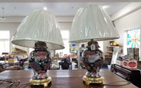 Two Table Lamps, floral decoration brass bases with modern shades.