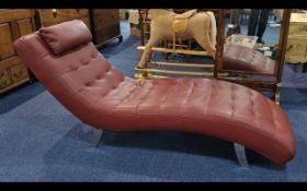Large Dark Red Leatherette Modern Chaise Longues, fitted headrest, steel legs.