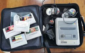 Games Interest - Super Nintendo with games and controller, together with a bag.