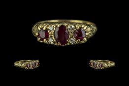18 ct Ruby & Diamond Ring, set with three rubies between four diamond spacers, fully hallmarked,