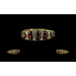 18ct Gold Garnet & Diamond Ring, five graduating garnets with diamond spacers,