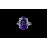 Amethyst Solitaire Ring, an 11ct oval cut amethyst of a rich, noble purple shade, set in an open