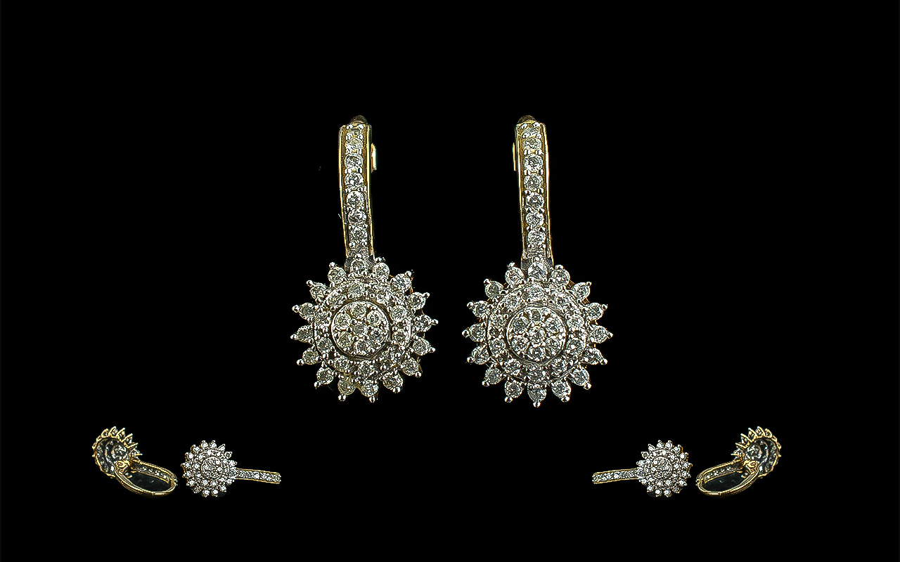 Pair of Diamond Cluster Earrings, diamond sunburst drop set in 9ct gold.