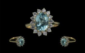 Ladies 9ct Gold Diamond and Aquamarine Set Cluster Ring. Marked 9ct. The Aquamarine and Diamonds