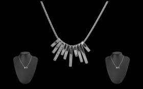 18ct White Gold Diamond Set Necklace, comprising ten white gold drops,