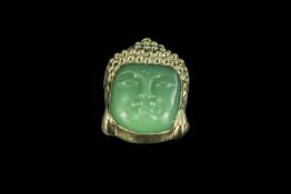 Jade Buddha Pendant, carved face with yellow metal surround, measures approx. 2'' x 1''