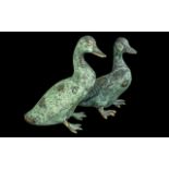 Pair of Bronze Ducks, 8'' tall, finished with a green patina. Attractive items for home or garden.