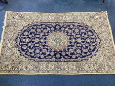 A Large Iranian Woolen Rug, 300 x 200 cm.