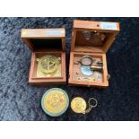 Two Sundial Compasses, in fitted wooden boxes, together with a desk top and pocket calendar.