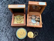 Two Sundial Compasses, in fitted wooden boxes, together with a desk top and pocket calendar.