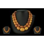 A Superb Early 20th Century Double Strand Butterscotch - Natural Amber Beaded Necklace with Silver