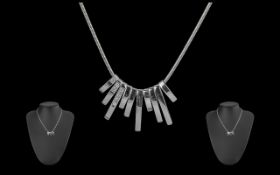 18ct White Gold Diamond Set Necklace, comprising ten white gold drops, three drops set with round