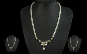 Freshwater Pearl & Diamond Set Necklace, with gold mount, and gold and diamond set centre. Approx