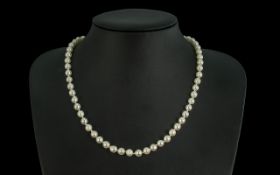 9ct Gold Cultured Pearl Necklace, with ball clasp, 17'' long, knotted. With original valuation of £