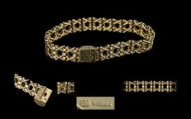 Ladies Attractive and Well Made 9ct Gold Kisses x Bracelet. Fully Hallmarked. Hallmark London